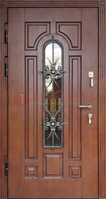 Входная дверь со стеклом и ковкой для частного дома ДСК-188 в Краснознаменске