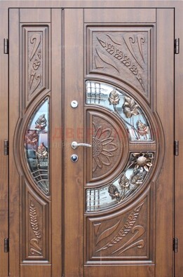 Уличная дверь в цвете Итальянский орех с виноритом и ковкой со стеклом ДВТ-147 в Подольске